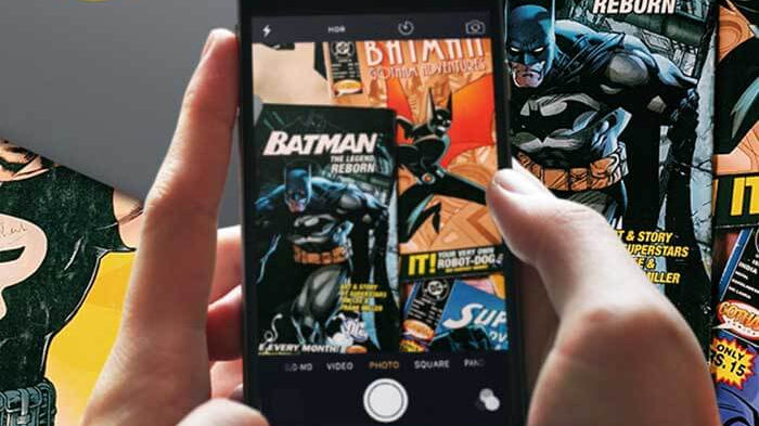 Superhero designs by PlugYou on a phone and laptop