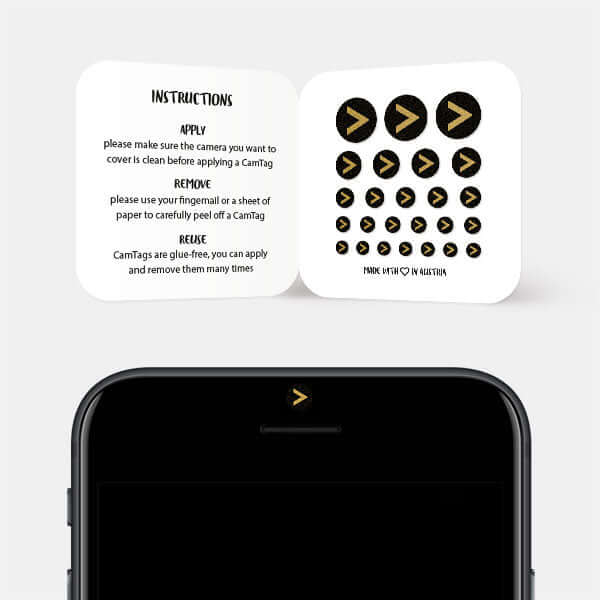golden "angle brackets" reusable privacy sticker CamTag on phone