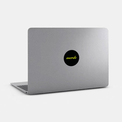 neon yellow "merde" reusable macbook sticker tabtag on a mac