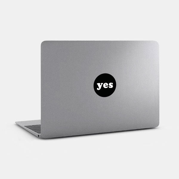 black yes reusable macbook sticker tabtag on a laptop