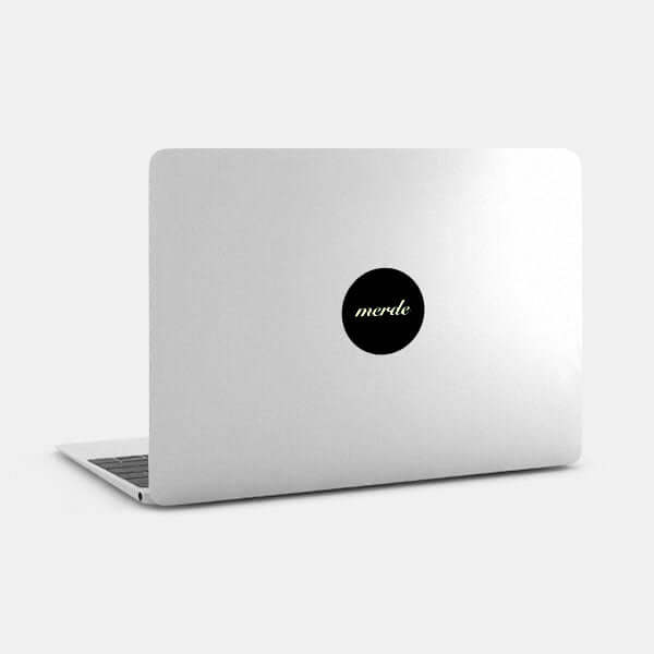 luminescent day merde reusable macbook sticker tabtag on a laptop