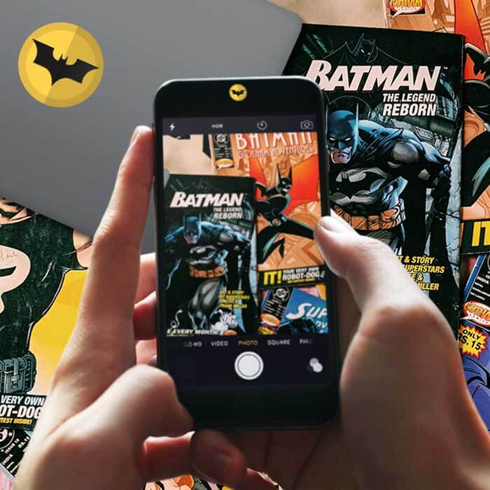 Superhero designs by PlugYou on a phone and laptop