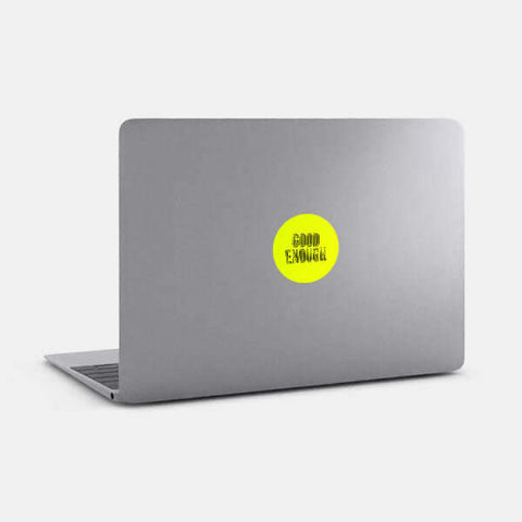 neon yellow "Good Enough" reusable macbook sticker tabtag on a laptop