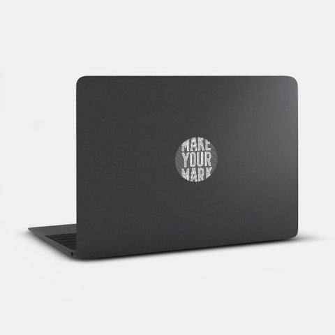 spaceblack "MakeYourMark" reusable macbook sticker tabtag on a laptop