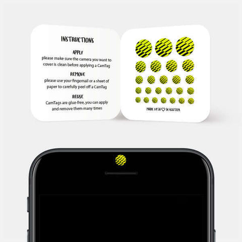 neon yellow "PatternLines2" reusable privacy sticker CamTag on phone