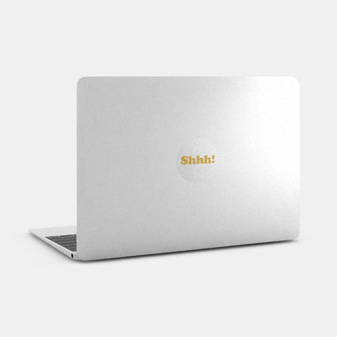 silver with golden "Shhh" reusable macbook sticker tabtag on a laptop