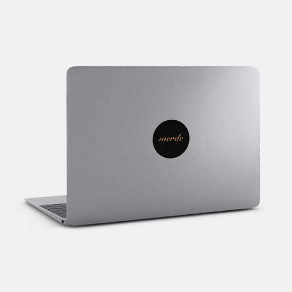 copper merde reusable macbook sticker tabtag on a laptop