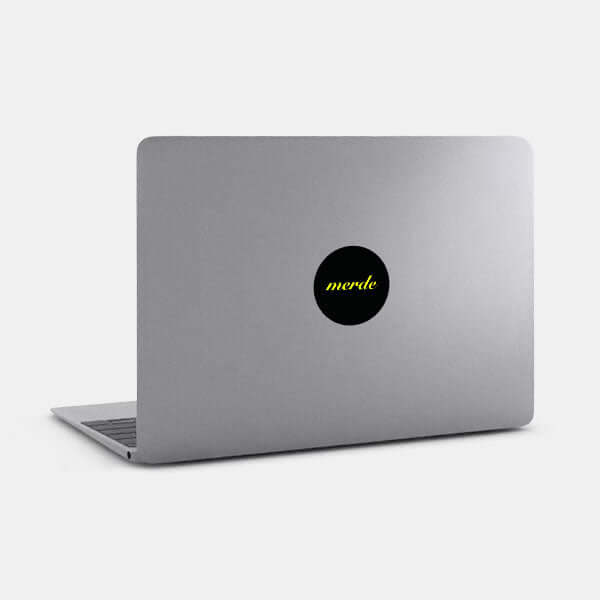neon yellow merde reusable macbook sticker tabtag on a laptop