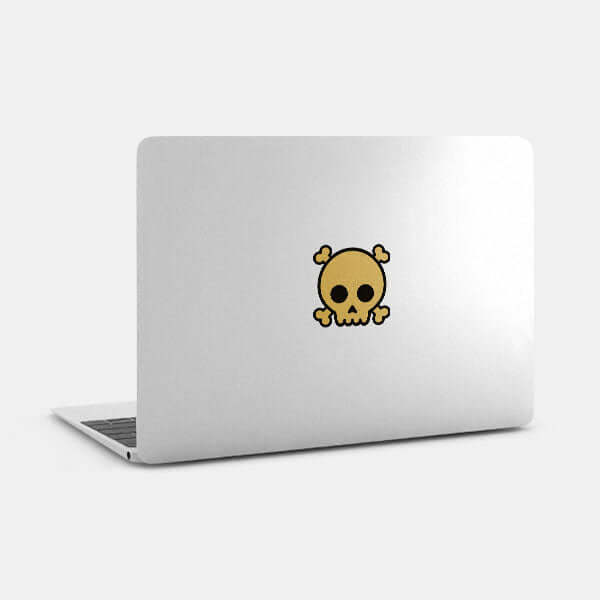 golden skull reusable macbook sticker tabtag on a laptop
