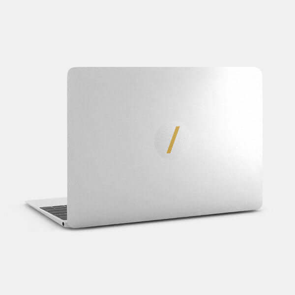 golden on silver slash reusable macbook sticker tabtag on a laptop
