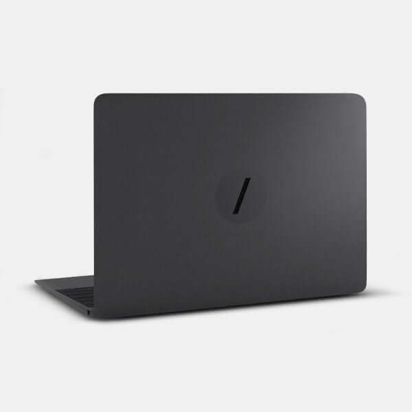 spaceblack slash reusable macbook sticker tabtag on a laptop