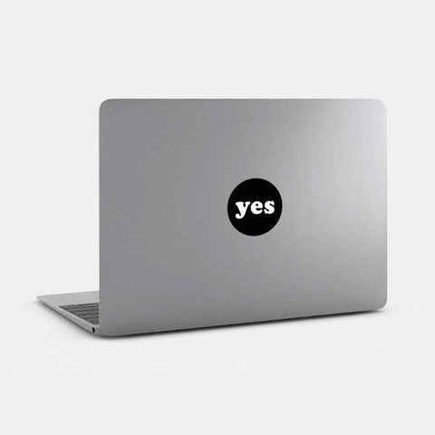 black yes reusable macbook sticker tabtag on a laptop