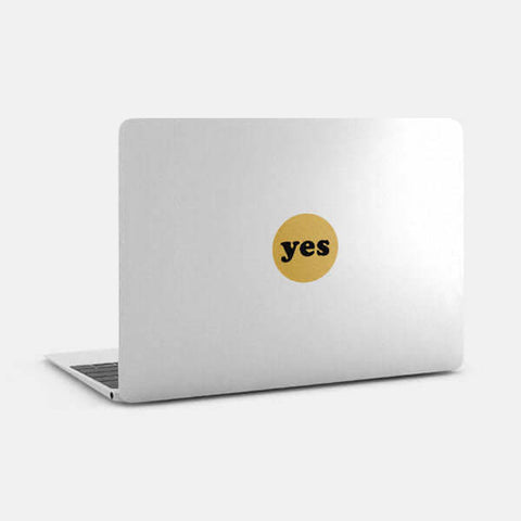 golden "yes" reusable macbook sticker tabtag on a laptop