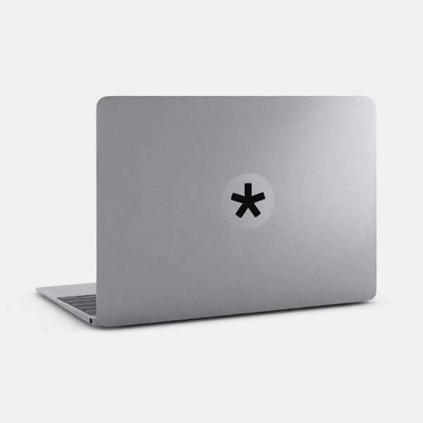 spacegray Asterisk reusable macbook sticker tabtag on a laptop