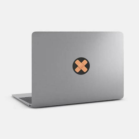 dark "band-aid" reusable macbook sticker tabtag on a mac by plugyou