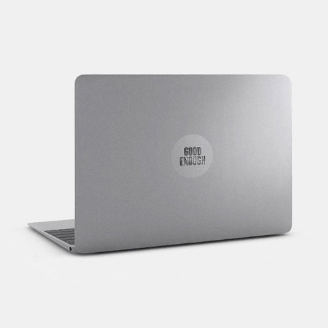 spacegray "Good Enough" reusable macbook sticker tabtag on a laptop
