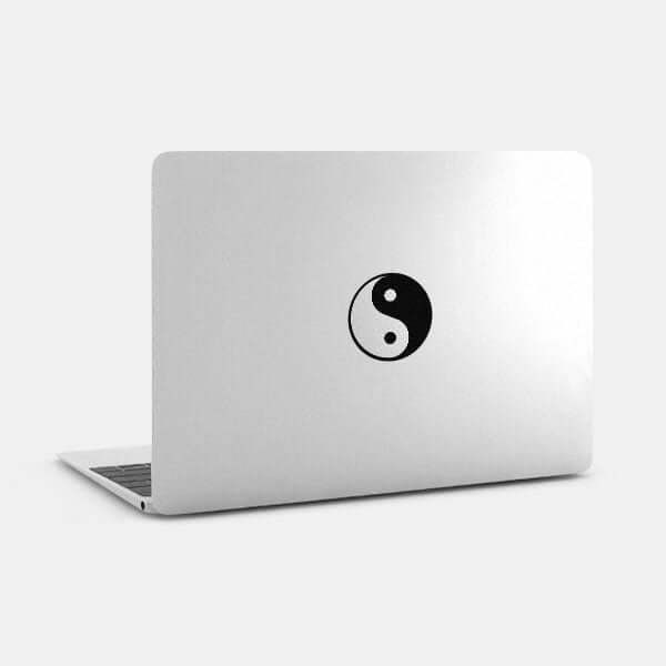 silver yin & yang reusable macbook sticker tabtag on a laptop