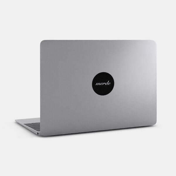 spacegray merde reusable macbook sticker tabtag on a laptop