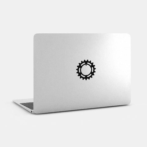 silver "pinion-a219" reusable macbook sticker tabtag on a laptop