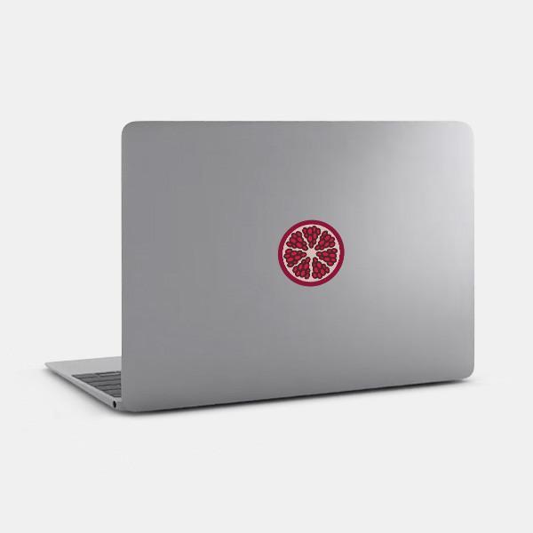 pomegranate tabtag reusable macbook sticker tabtag on a laptop