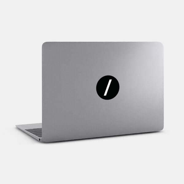 Black slash reusable macbook sticker tabtag on a laptop
